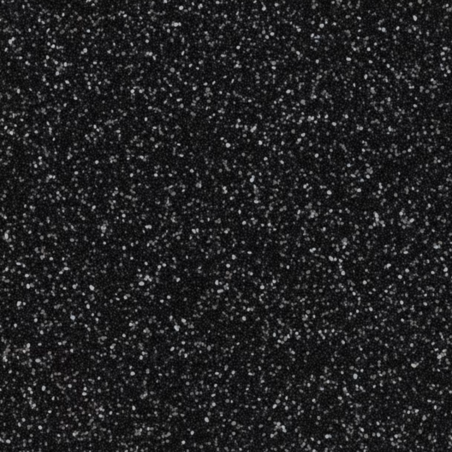 Black background with small, scattered white flecks.