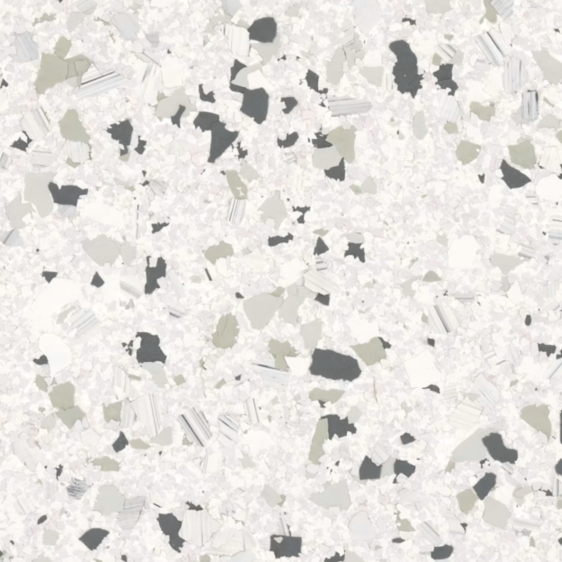 Un gros plan d'une tuile blanche avec des taches noires dessus