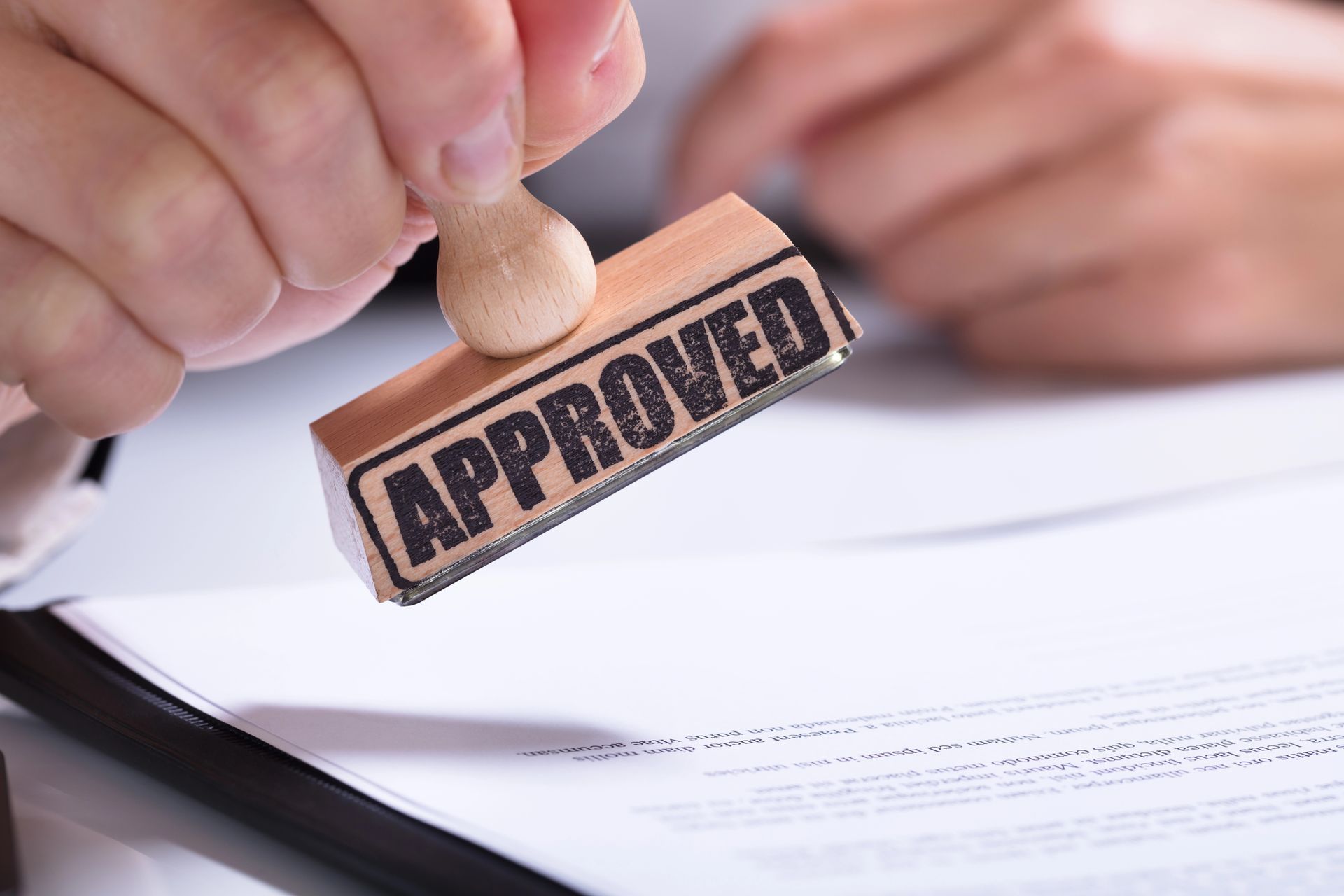 Hand stamping a document with an