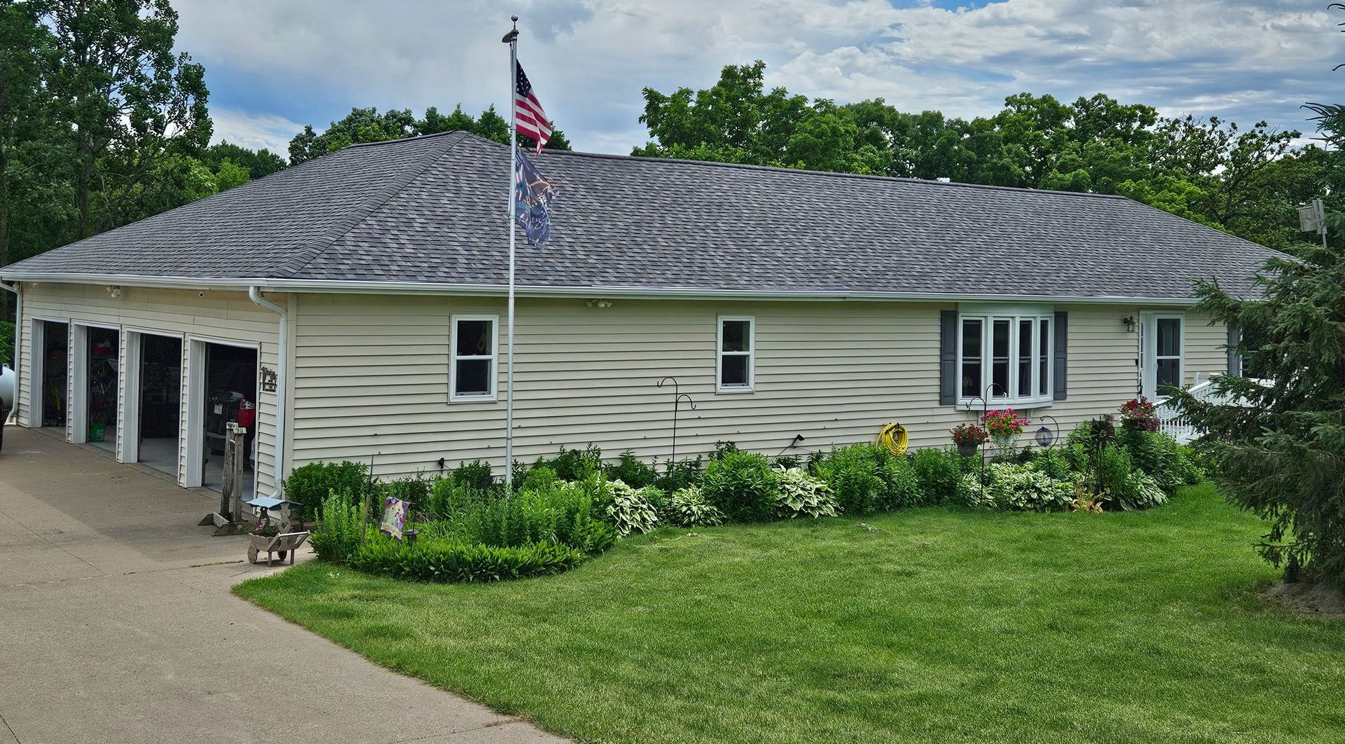 A white house with an american flag on the roof.