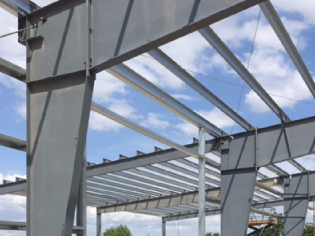 A large house with a lot of windows is being built.