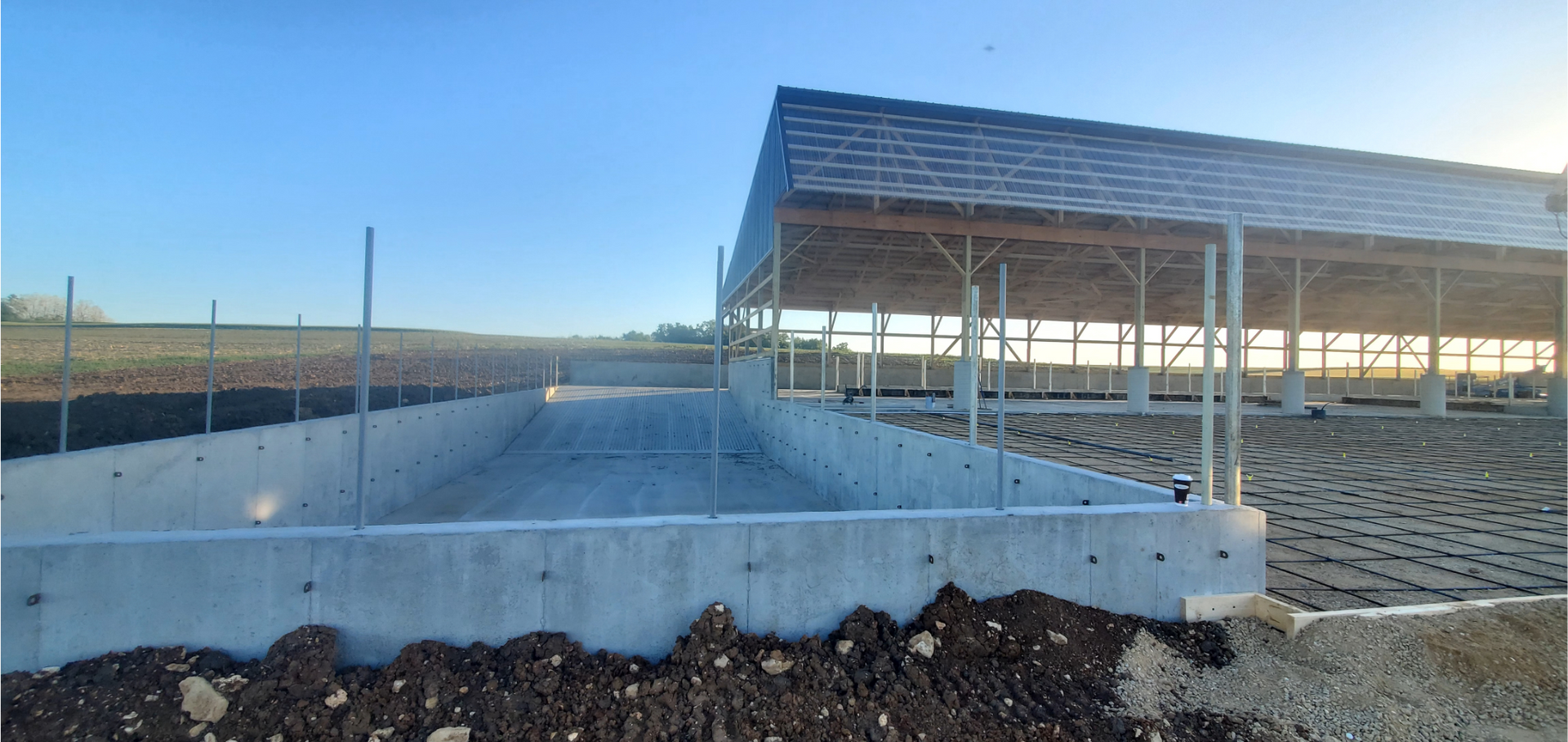 A group of construction workers are working on a concrete floor