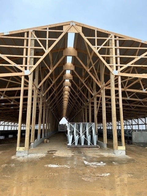 A very long building with a lot of wooden beams