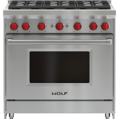 Stainless steel Wolf range oven with red knobs and a black glass door, front view