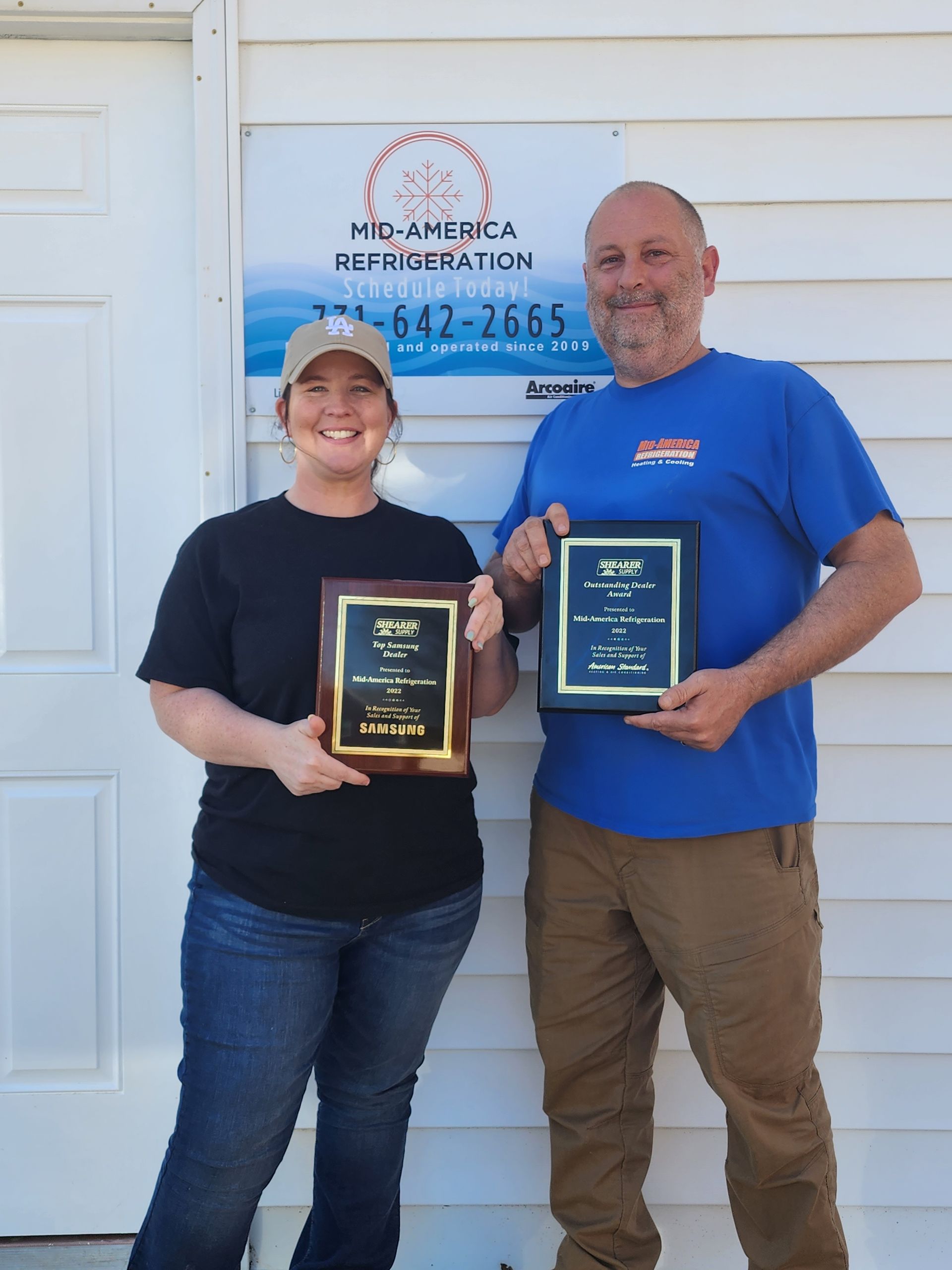 Couple Holding Awards — Paris, TN — Mid America Refrigeration Couple Holding Awards — Paris, TN — Mid America Refrigeration