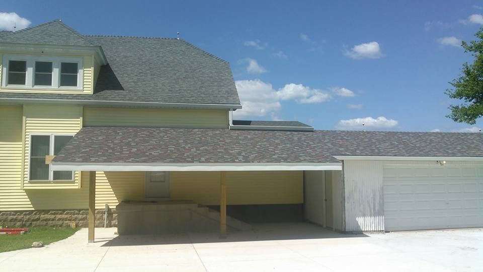 A house with a carport underneath it