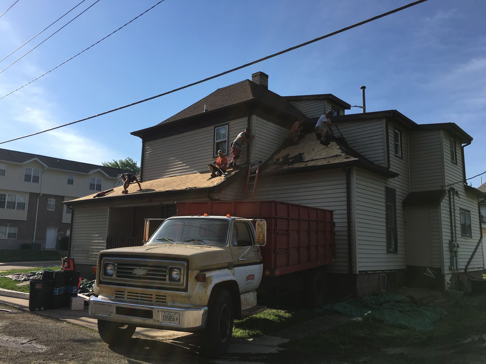 A ford truck is parked in front of a house
