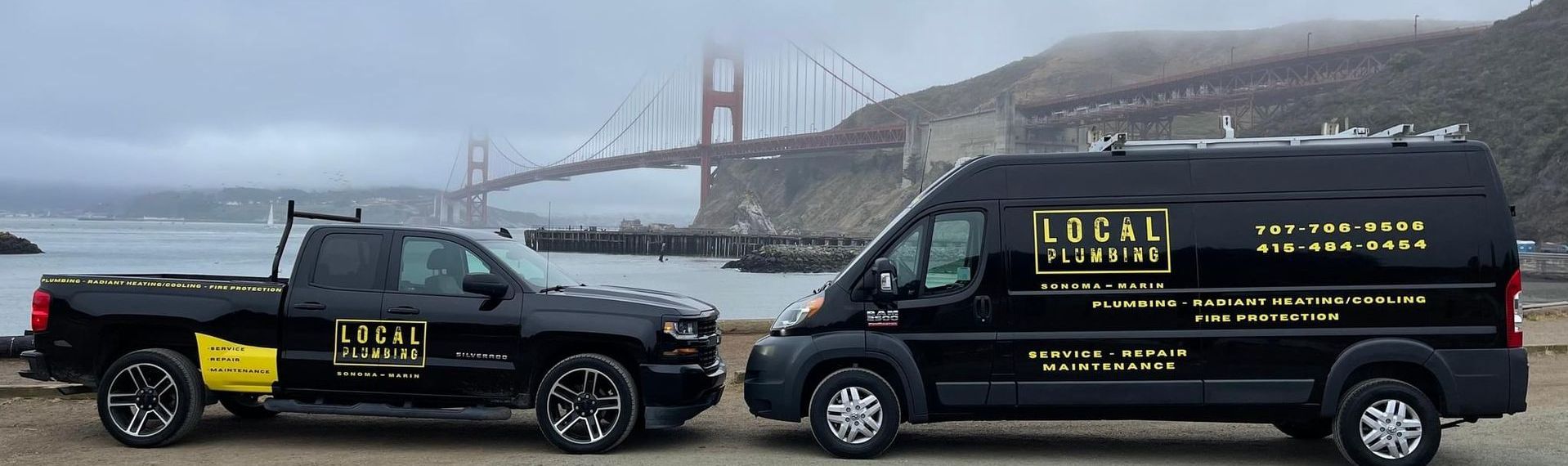 Black work truck and van with company logo in front of the Golden Gate Bridge on a foggy day.