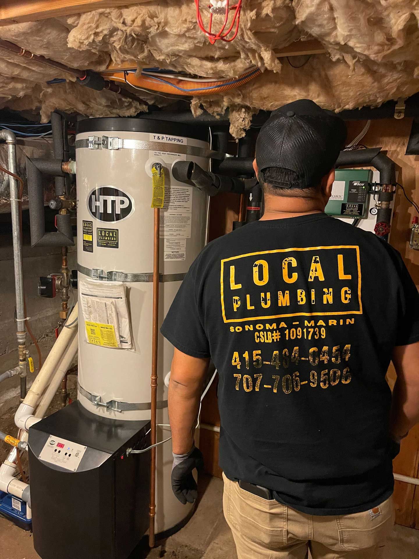 Plumber in black shirt with