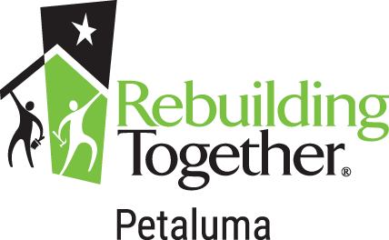 Rebuilding Together Petaluma logo: green and black figures building a house, with star; text.