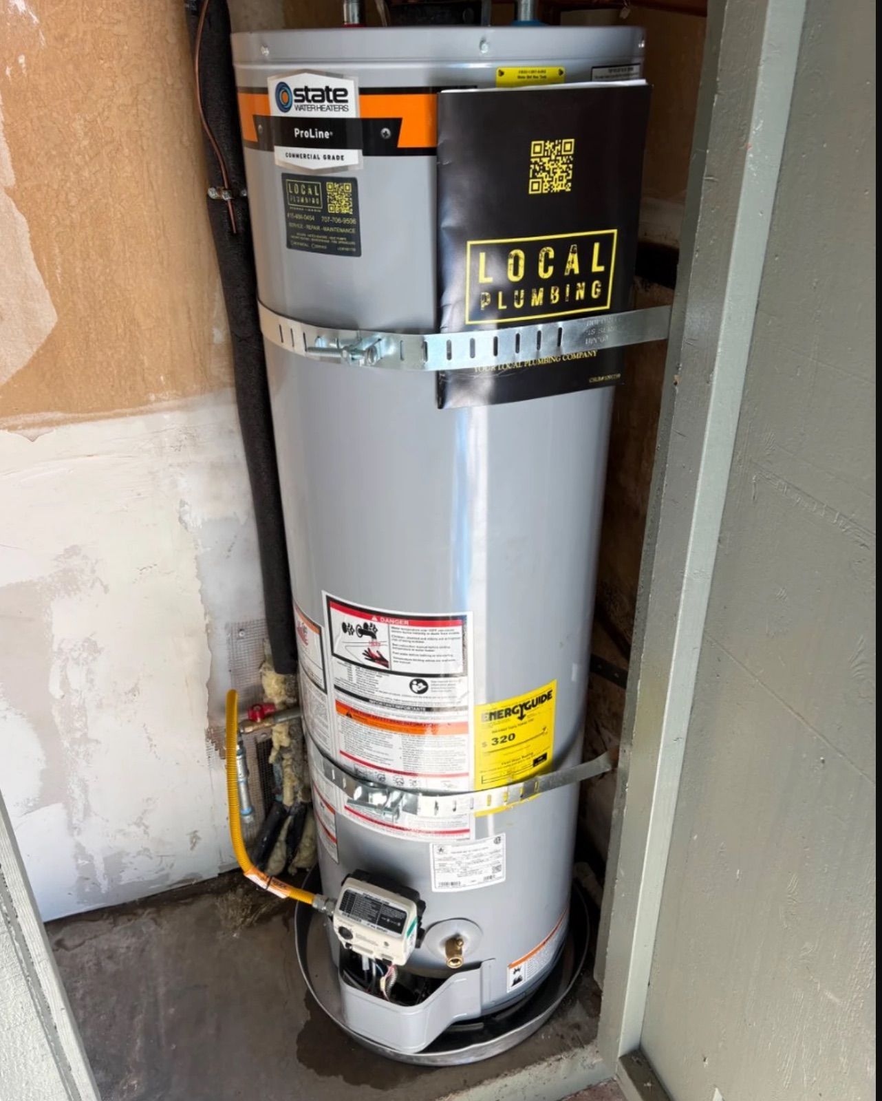 New State ProLine gas water heater installed by Local Plumbing in a closet, with seismic straps and a new gas line