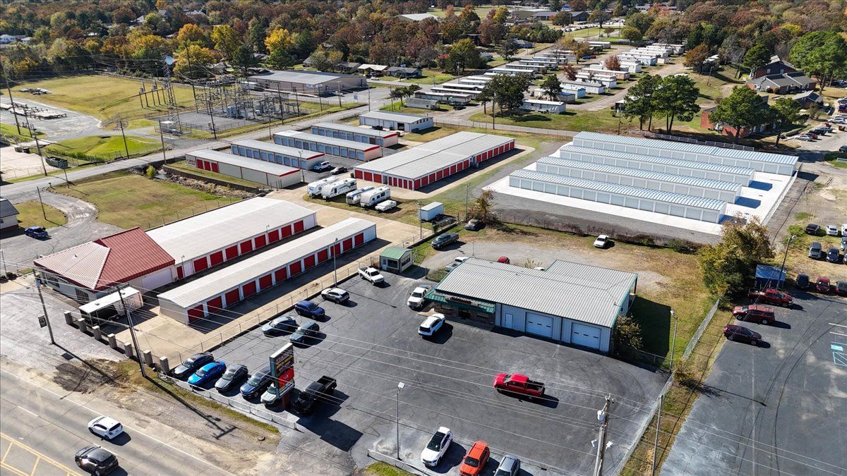 Aerial view of storage units, buildings, and a parking lot.