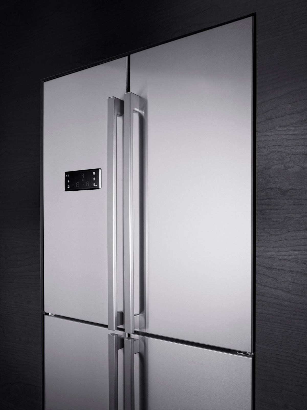 Stainless steel refrigerator with two doors and a bottom freezer drawer.