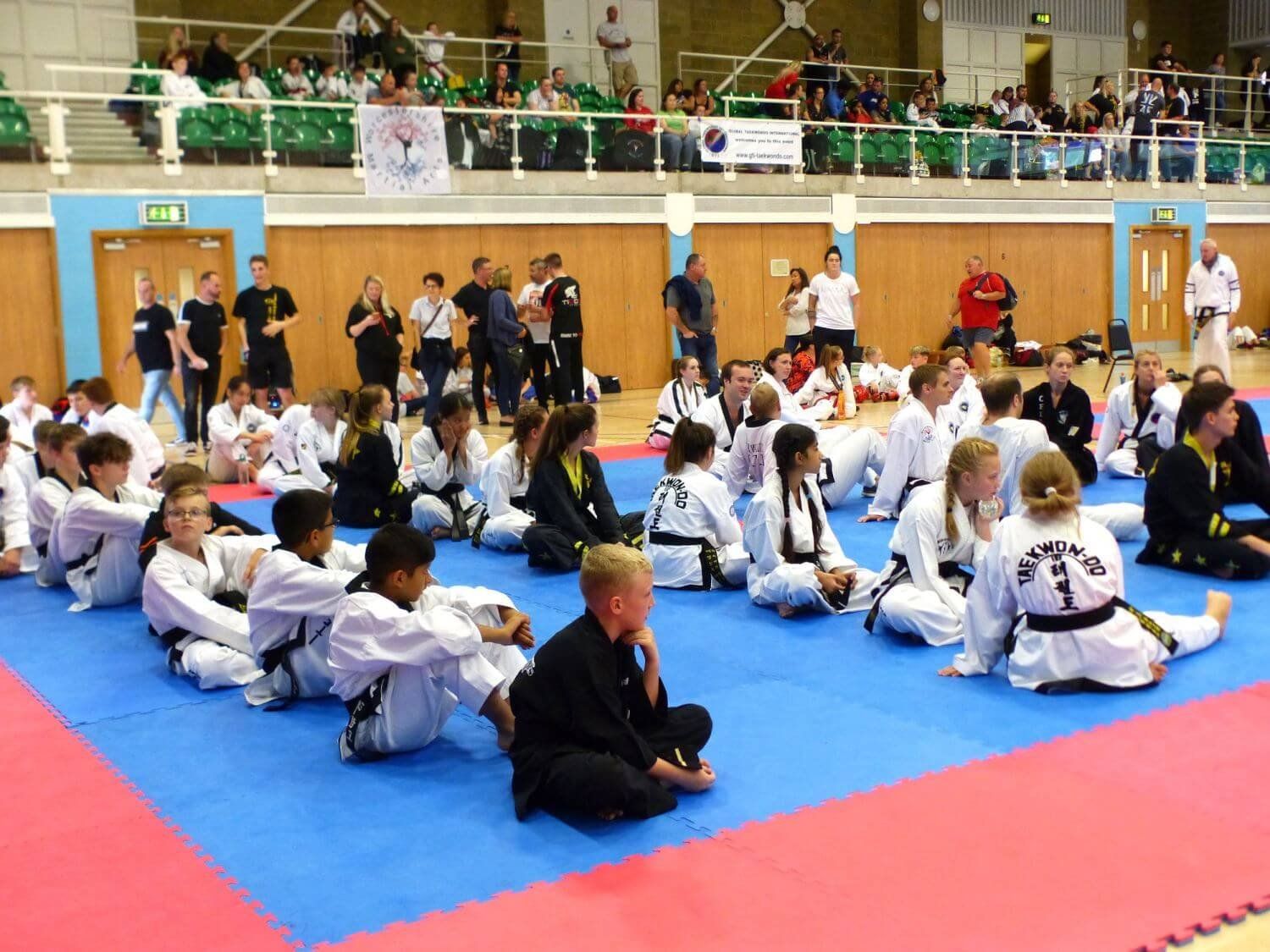 competitors on mats waiting to compete