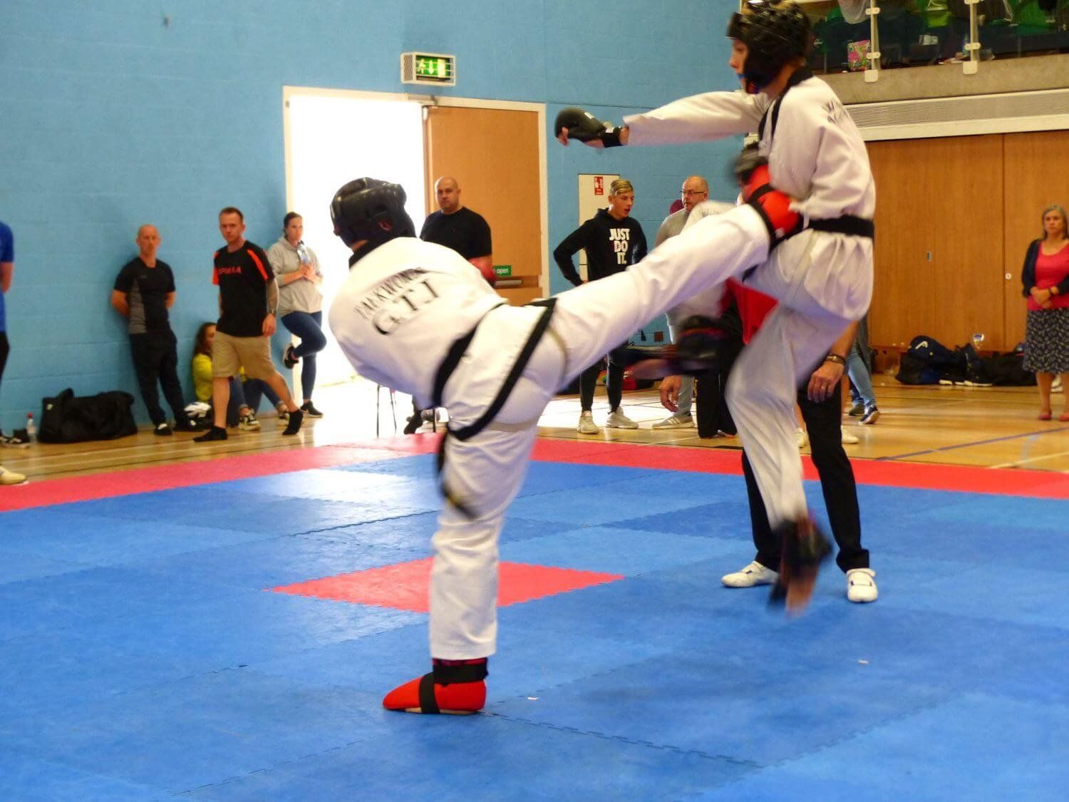 competitor side kicking