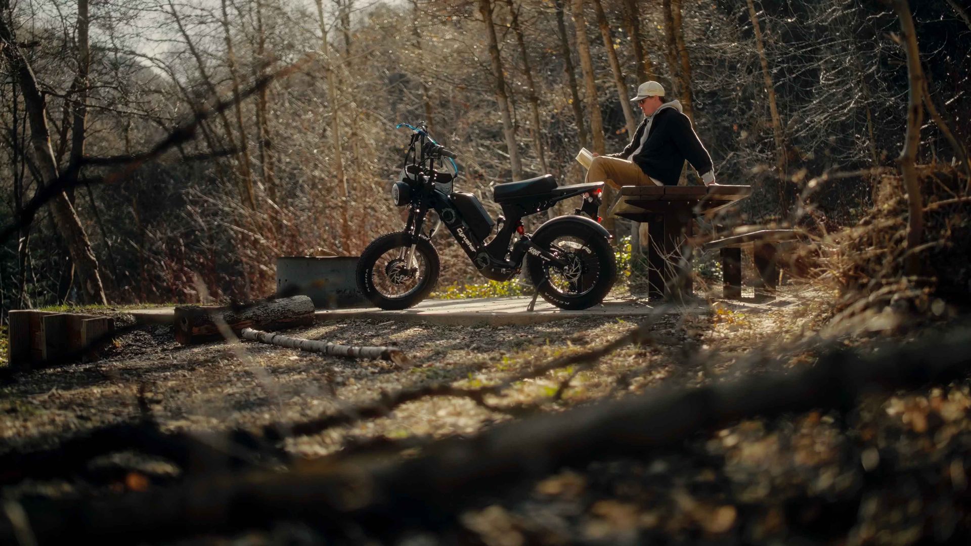 Rider exploring mountain trails on a Cyrusher eBike in the wilderness.