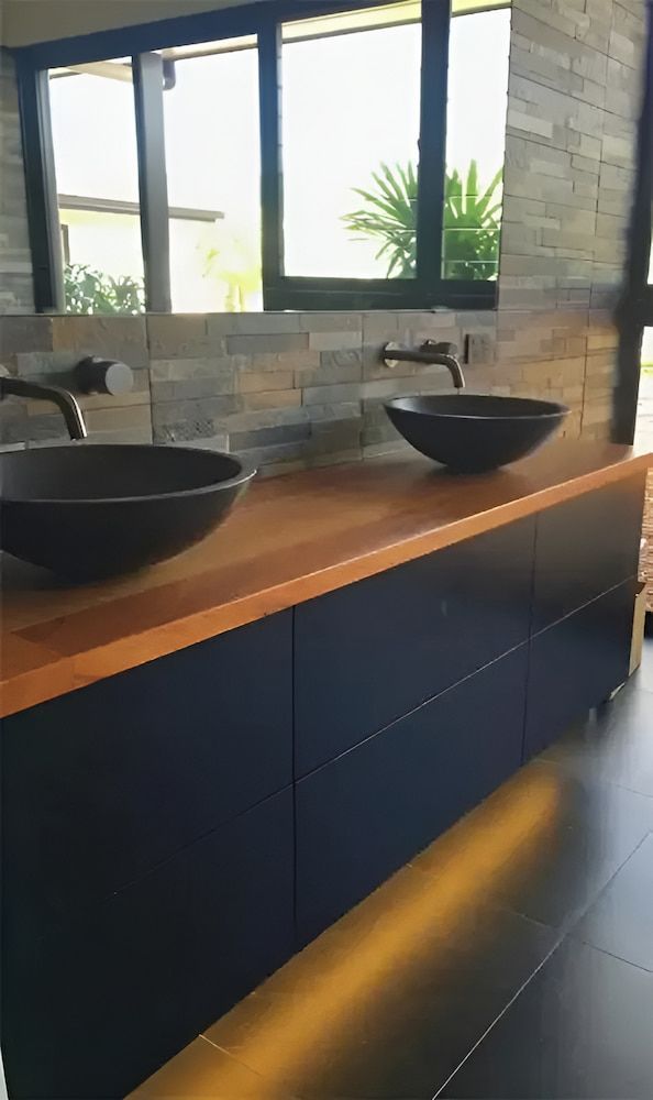 There Are Two Sinks On The Counter In The Bathroom — Reef Electrical in Cannonvale, QLD
