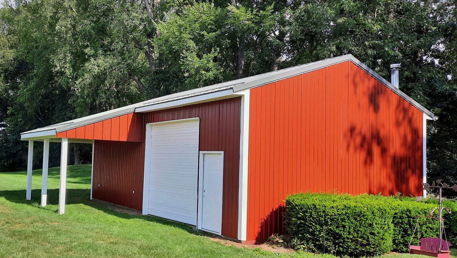 Red outbuilding with white trim