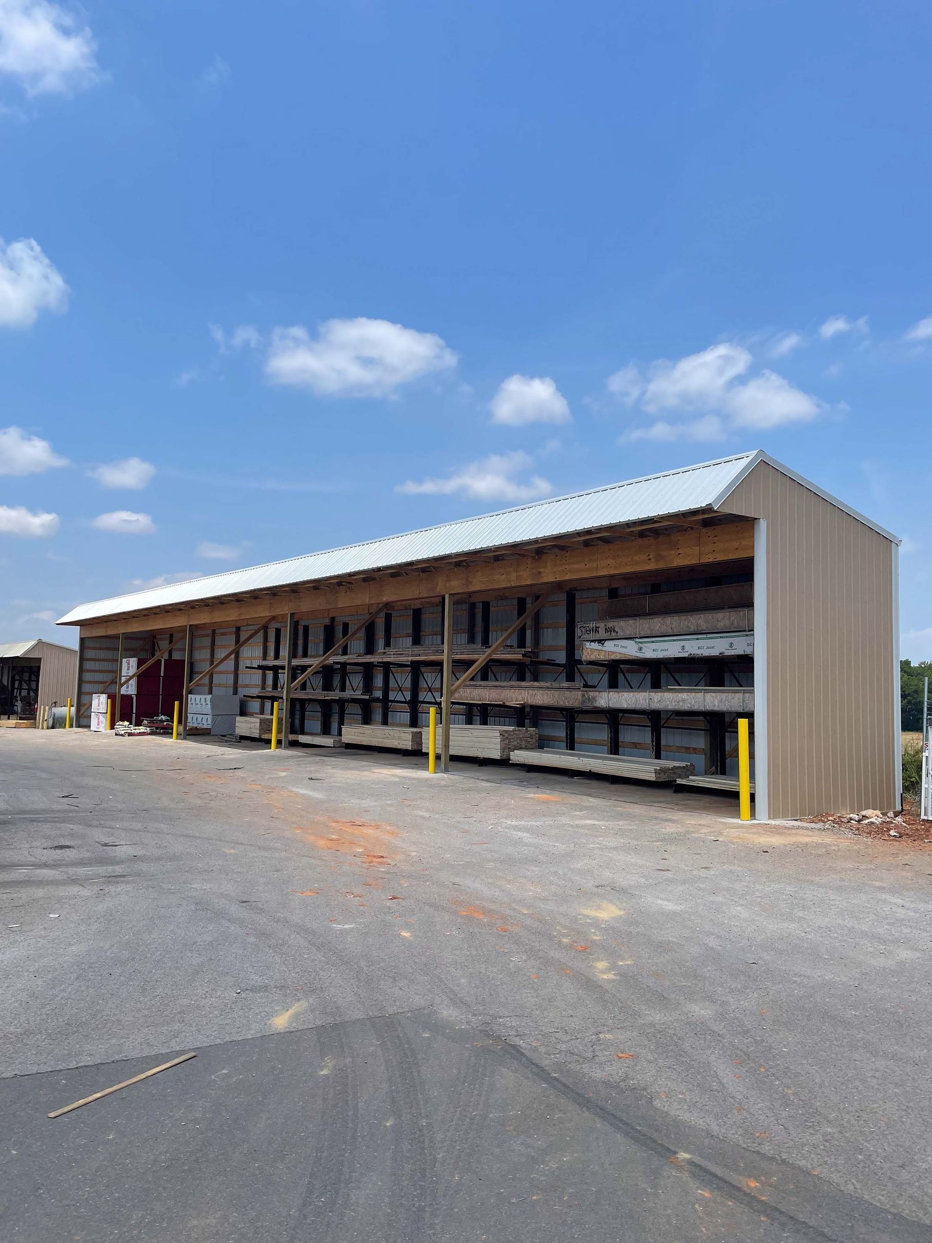 A large building with a lot of shelves and a blue sky in the background.