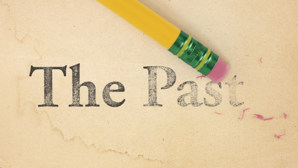 A pencil is erasing the words 