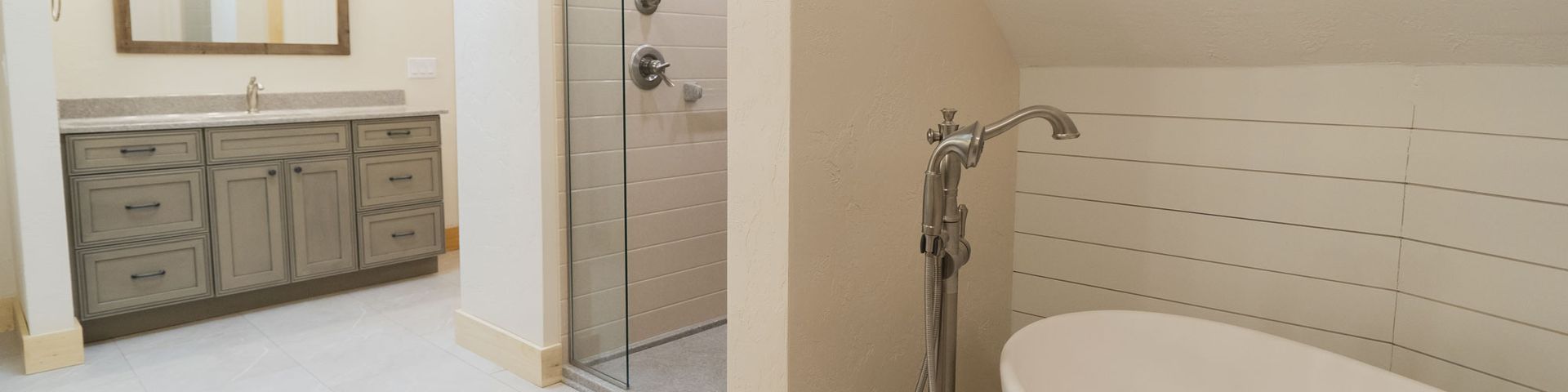 A minimalist bathroom with a vanity, shower door, and wall-mounted shower controls.