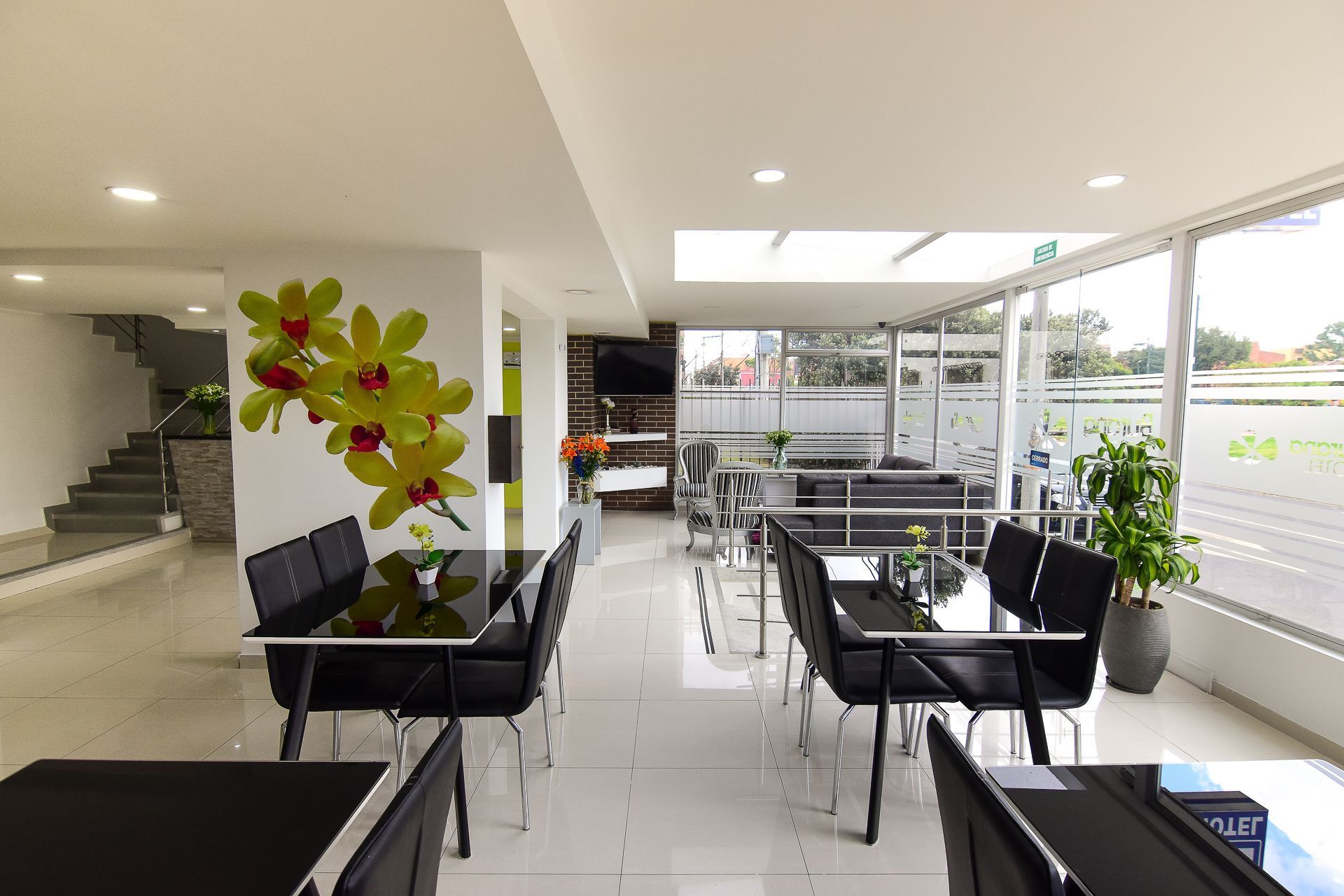 A large room with tables and chairs in it