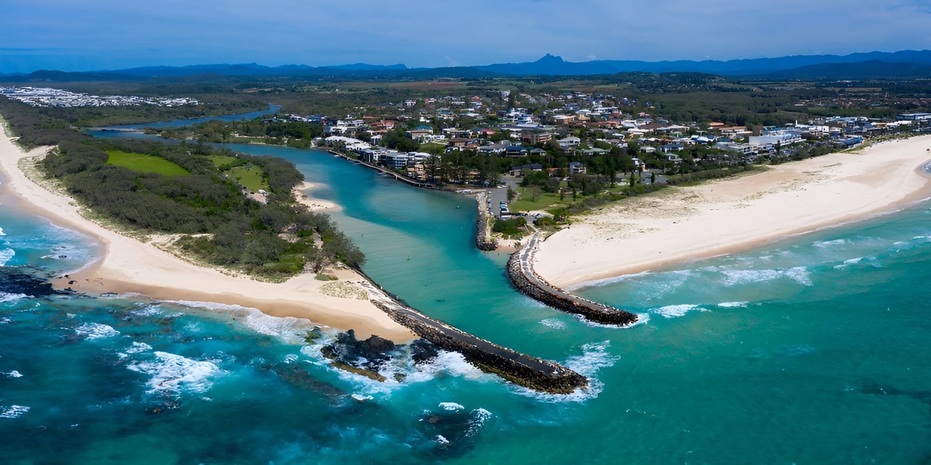 Aerial View of a Turquoise River — J & B Bus and Coach Pty Ltd In South Murwillumbah, NSW