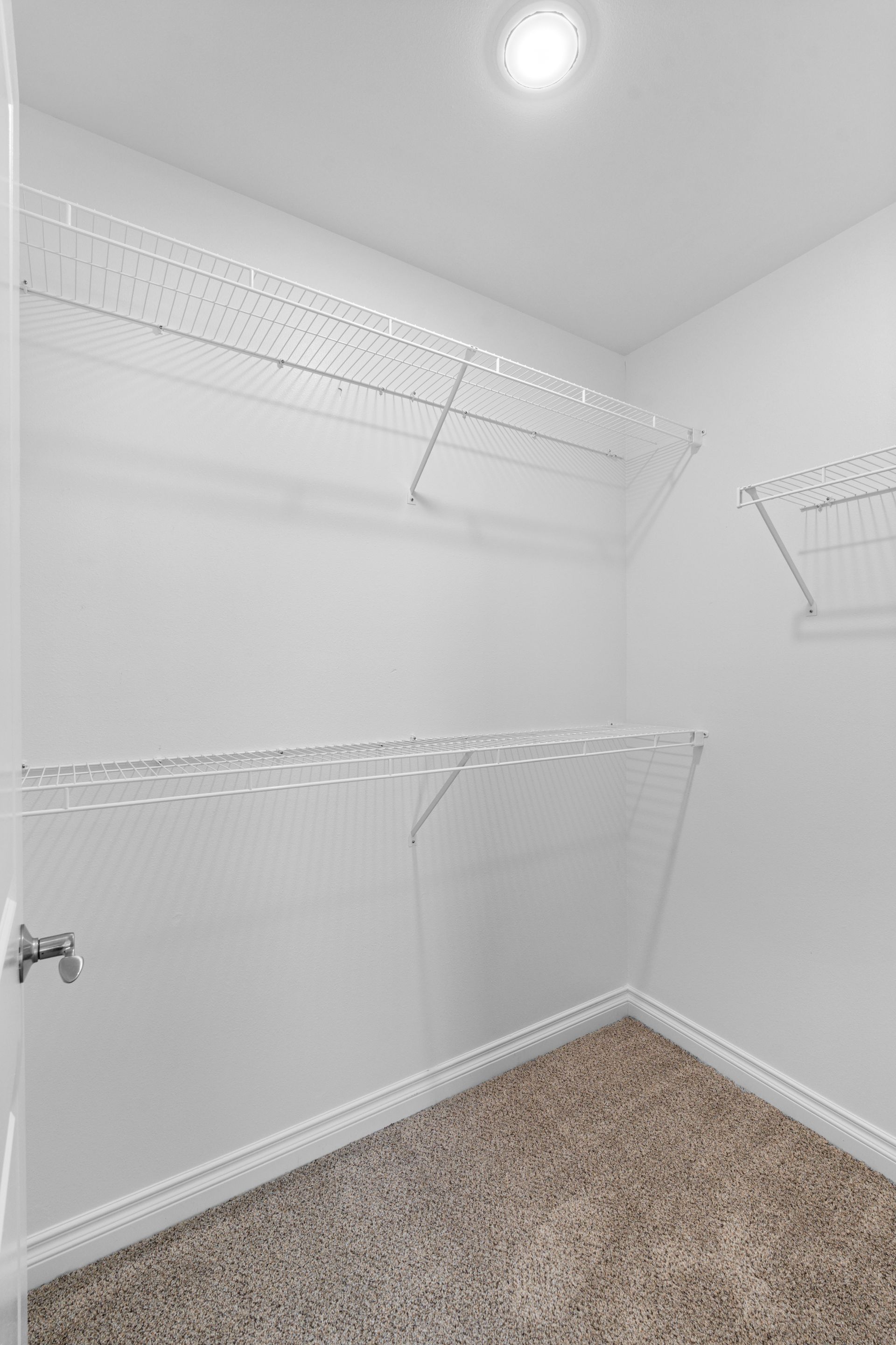 Photo of a walk-in closet with various racks