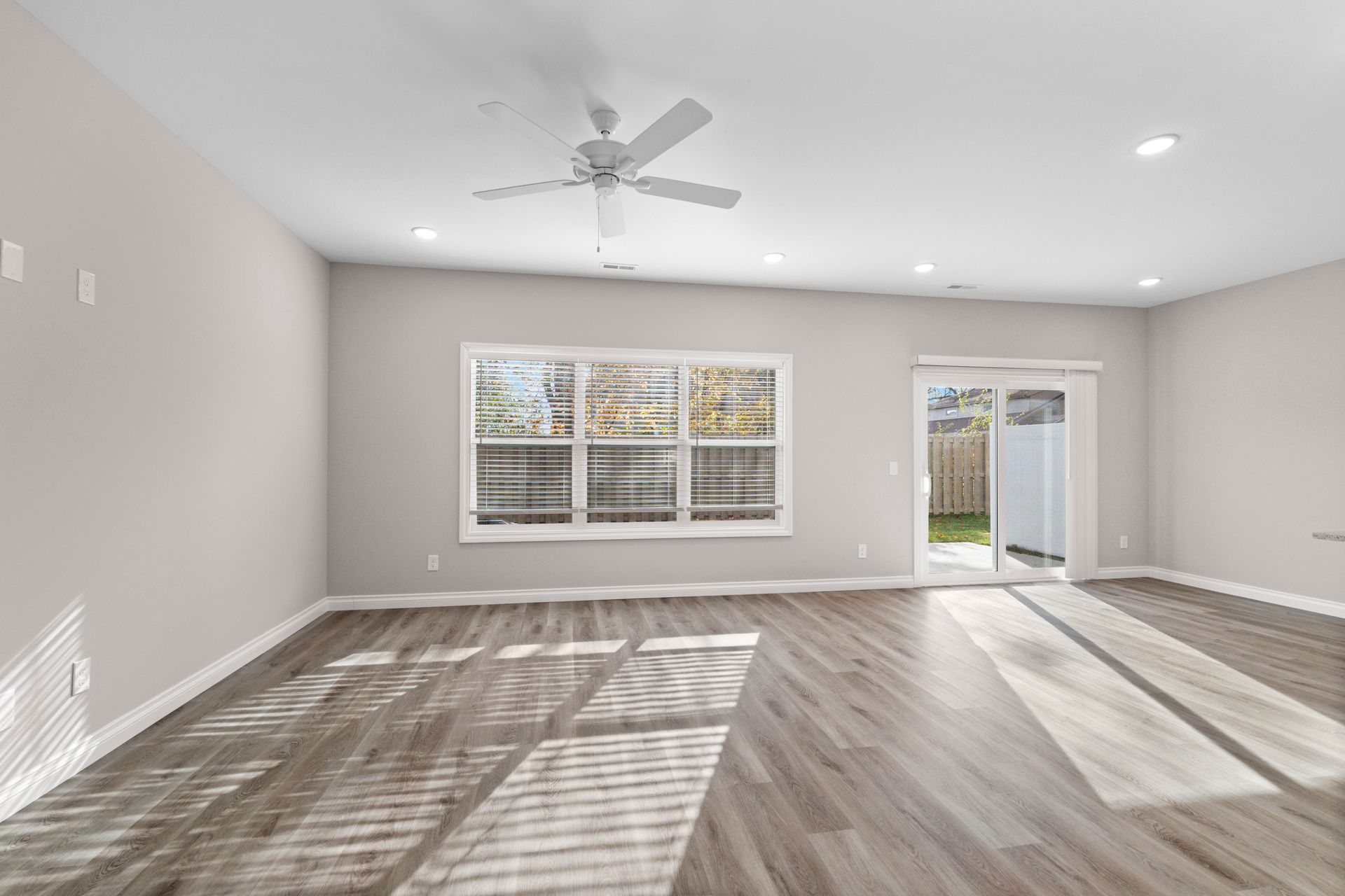 Photo of a wide, open space living room with plenty of natural lighting