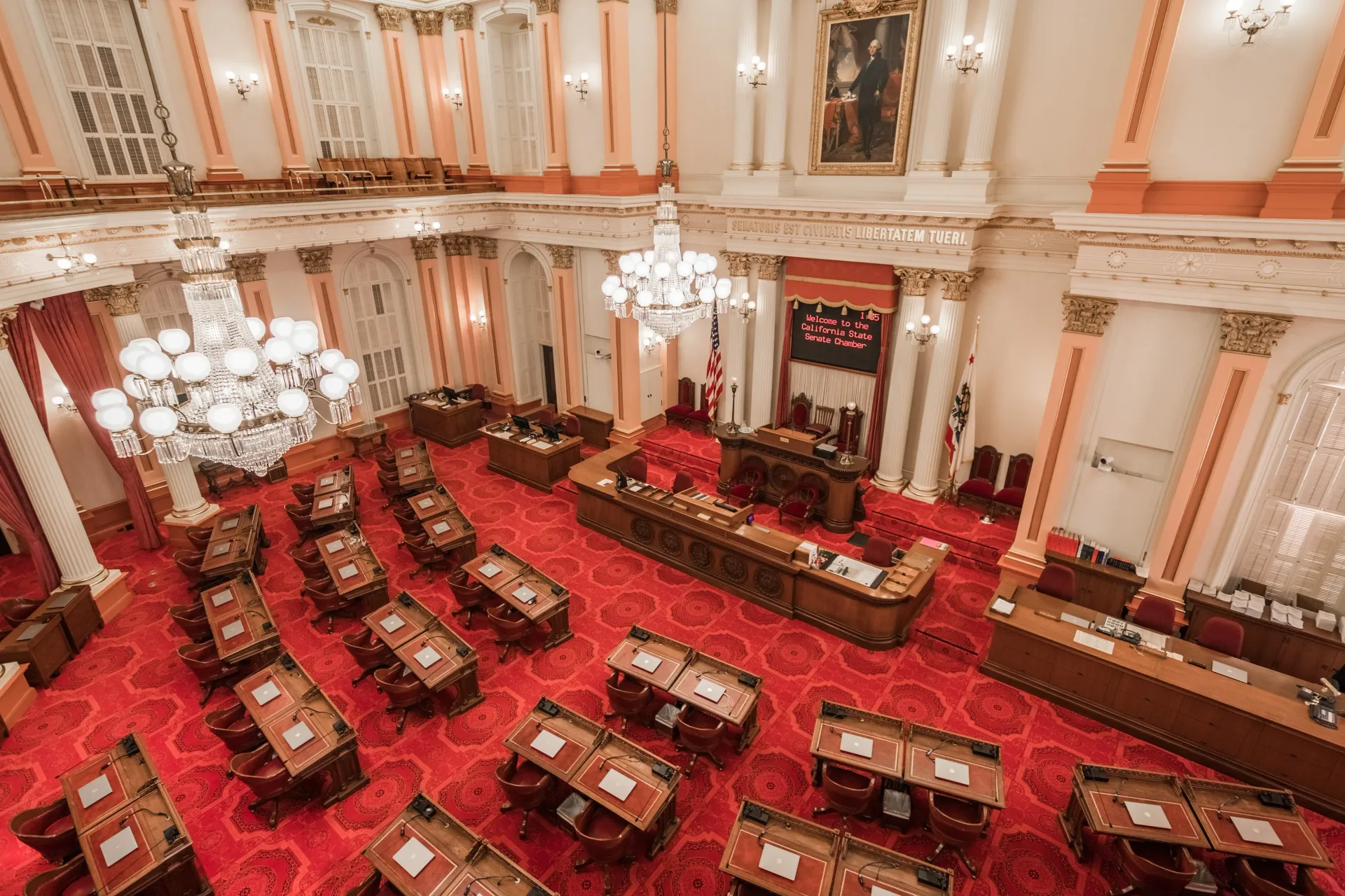 large red and white meeting room for lawmakers in Sacramento, California 