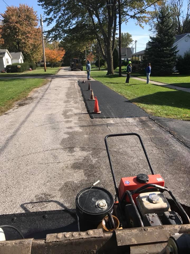Men Standing At Drive Way After Installed Paving — Northwood, OH — D & D Paving Inc.