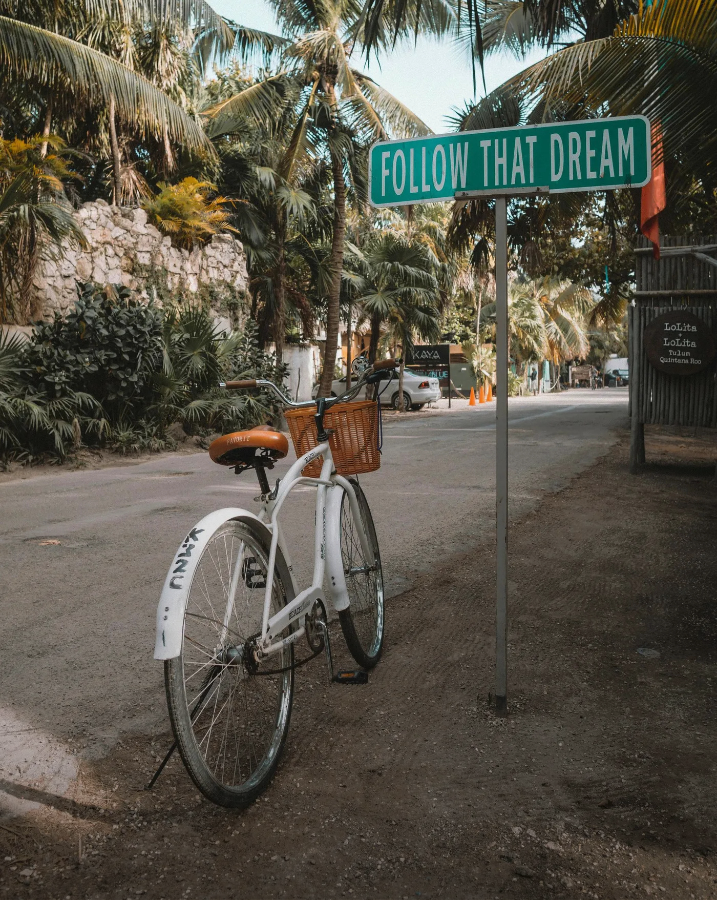 White bicycle with a basket and
