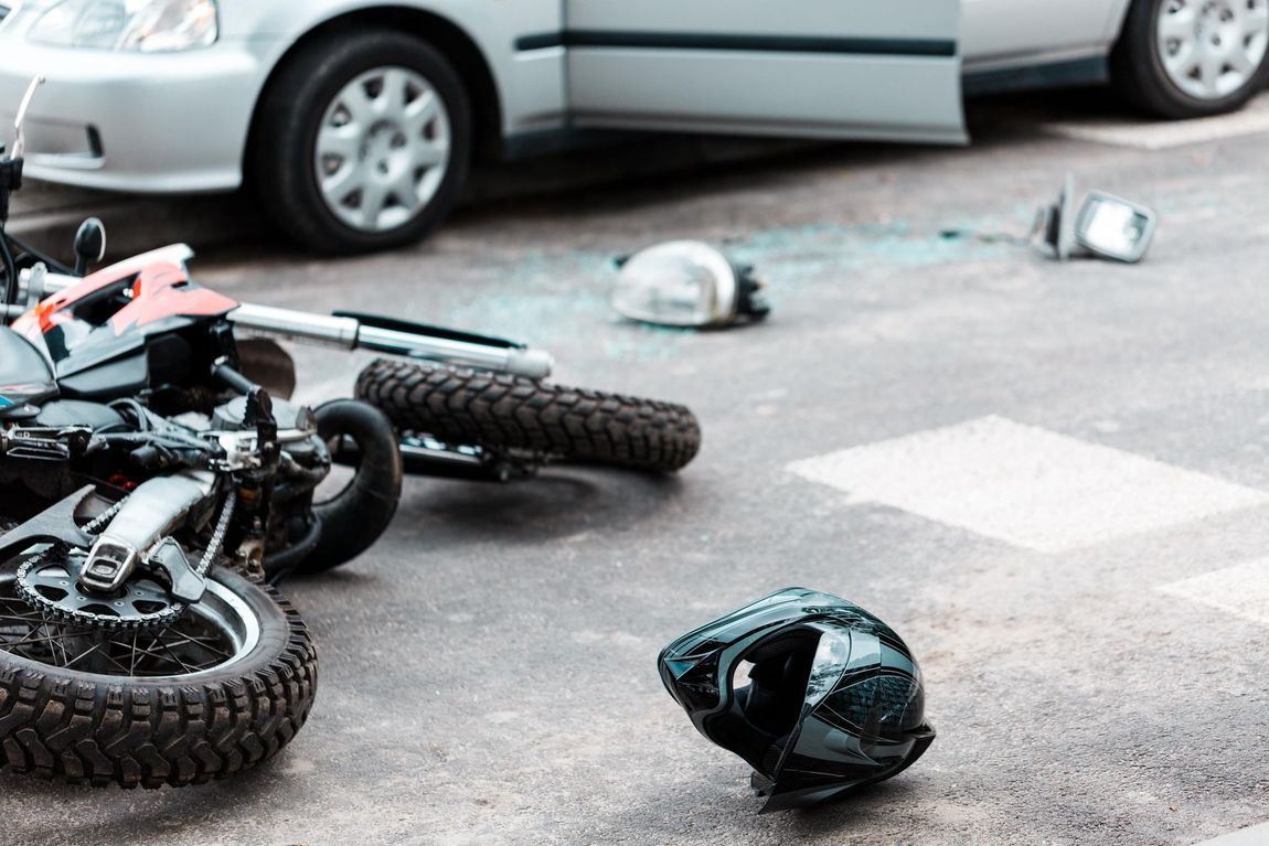 A motorcycle has crashed into a car on the street and looking for motorcycle accident lawyer near me A motorcycle has crashed into a car on the street and looking for motorcycle accident lawyer near me