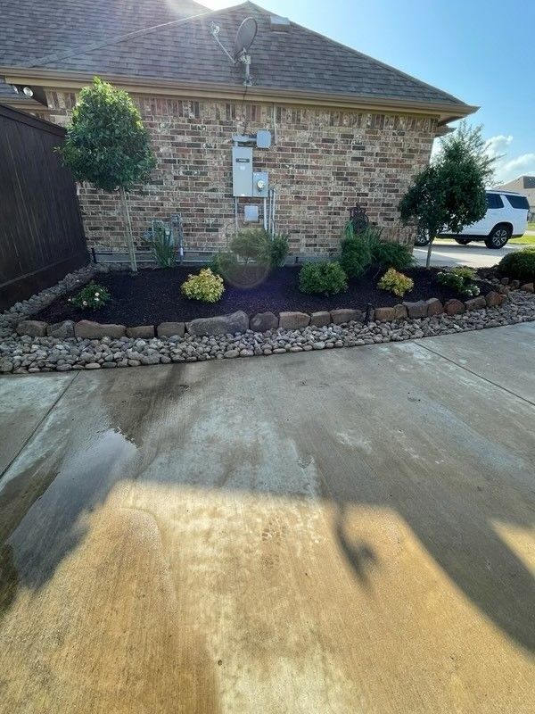 A brick house with a car parked in front of it.