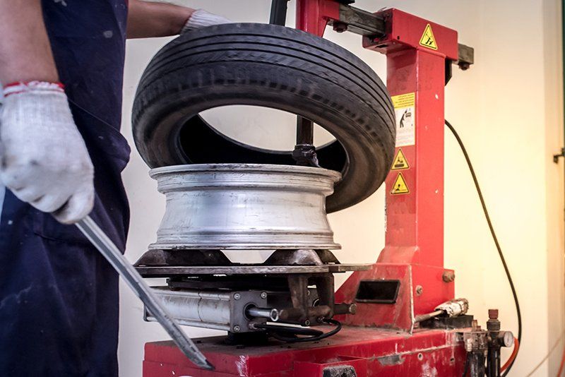 Person Using Tire Changing Device