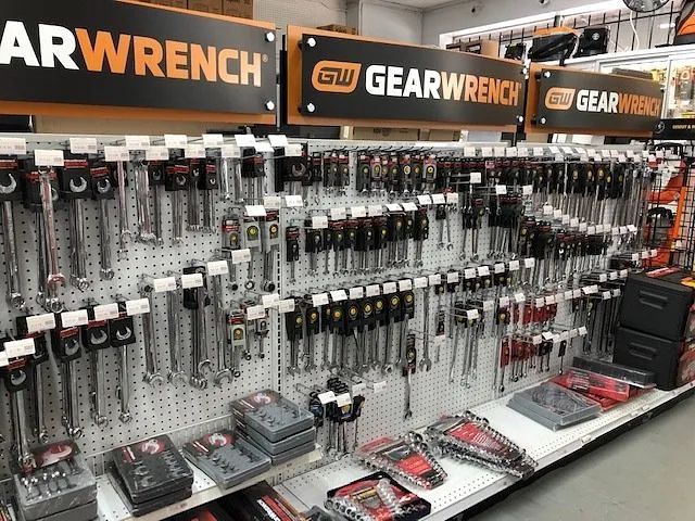 GearWrench tool display wall with hanging hand tools and boxed sets in a hardware store