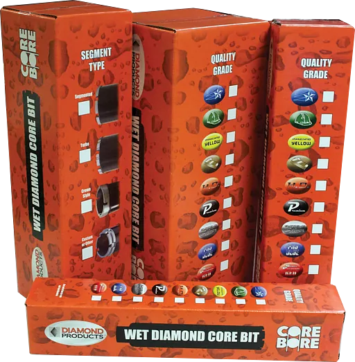 Red display of diamond core drill bits in orange boxes with assorted colored bits