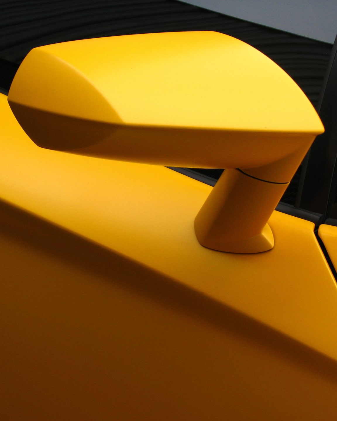 Yellow car side mirror.