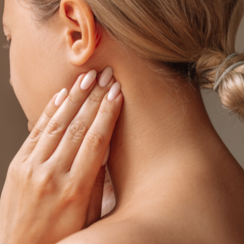 Woman holding her jaw