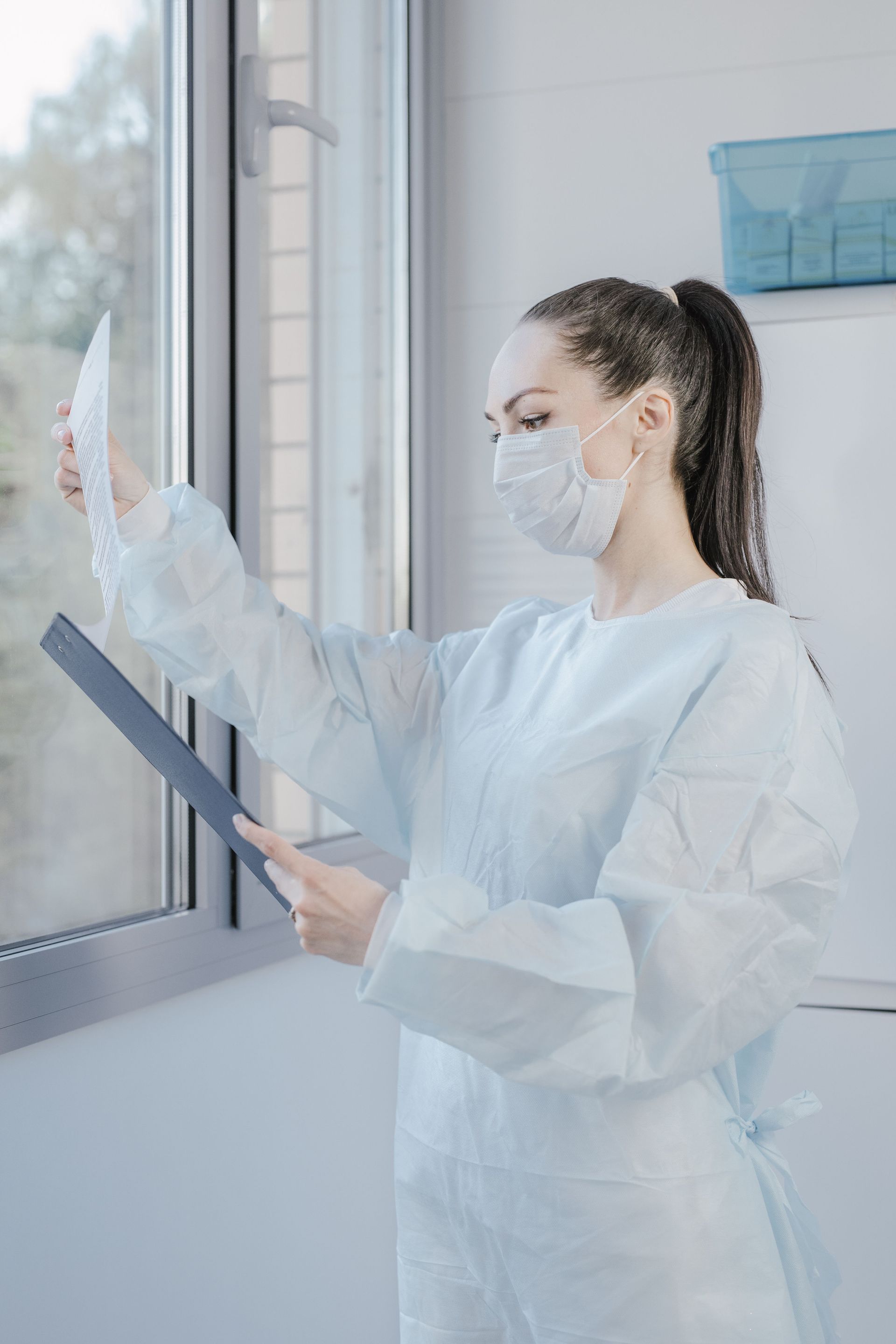 Clinician reviewing lab results with an adult patient in a calm Midtown East room.