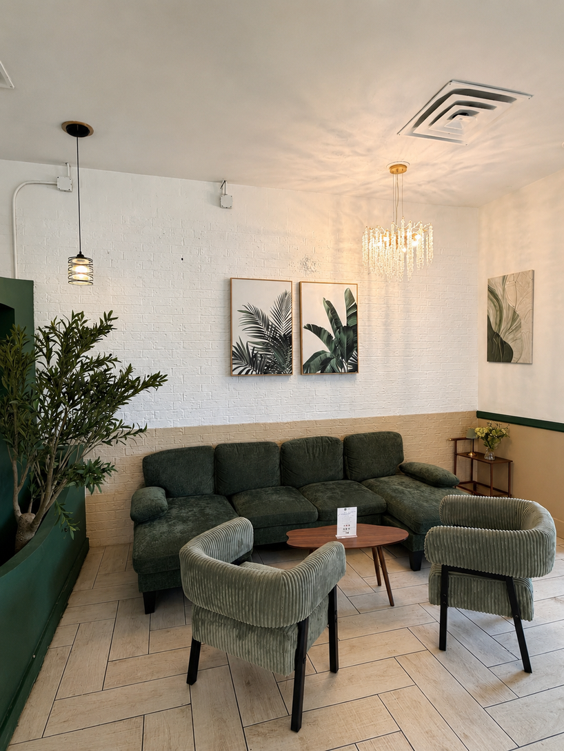 Bright cafe interior with blue booths, wicker chairs, white tables, and a tiled floor
