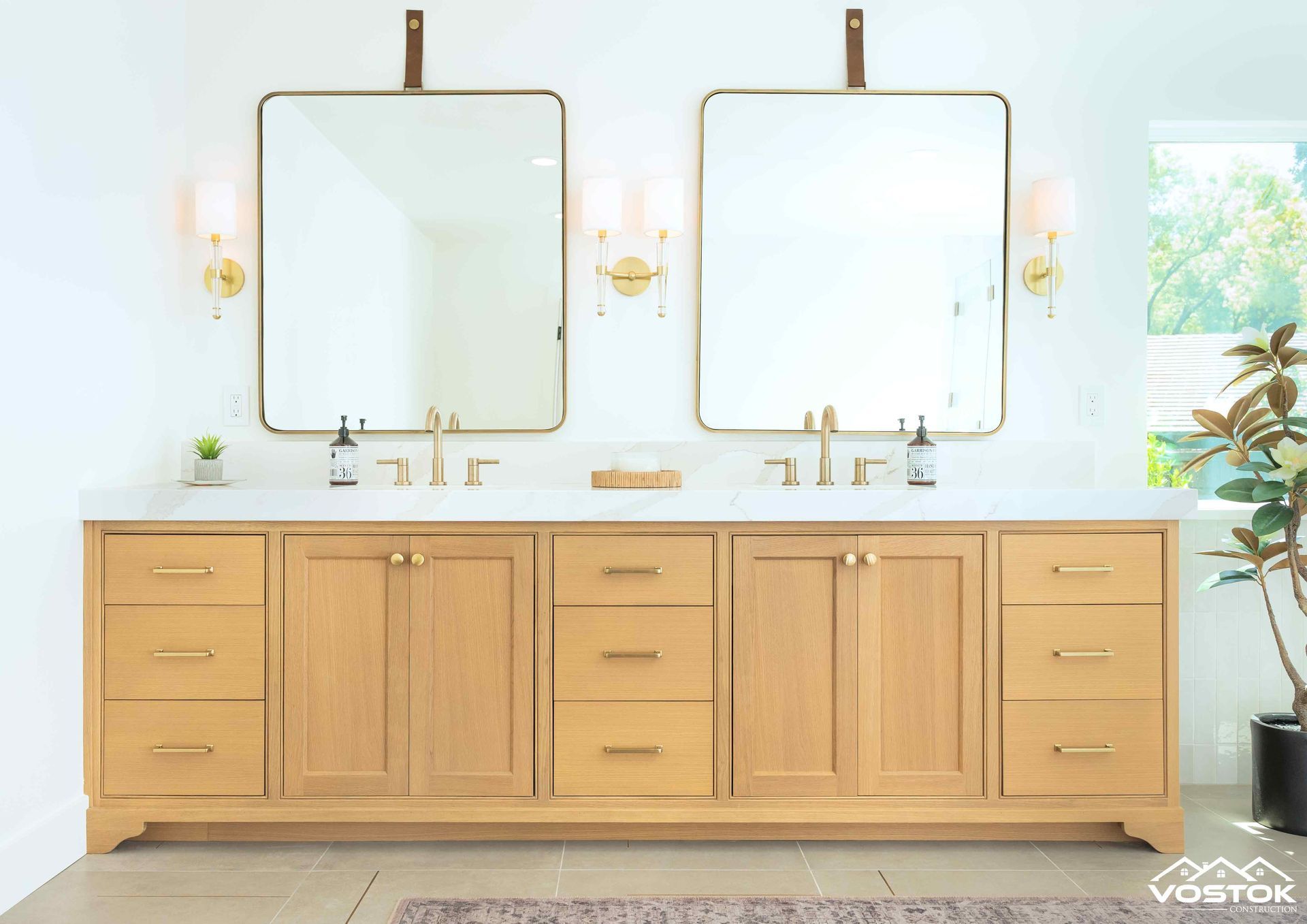 A bathroom with two sinks and two mirrors.