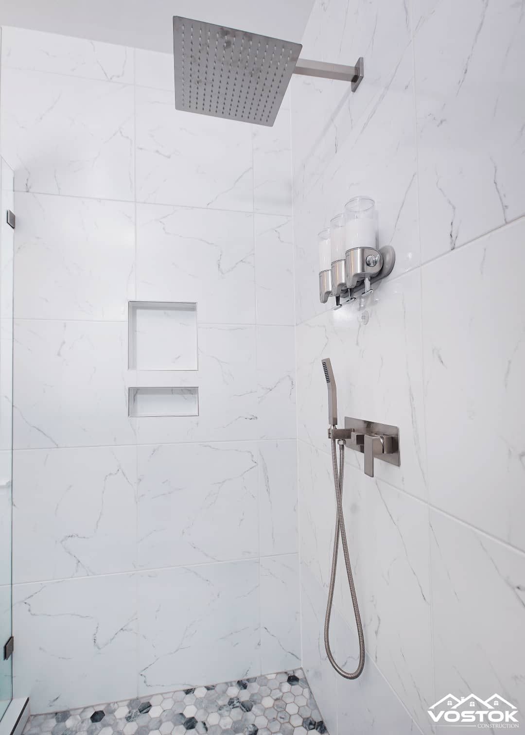A shower with a shower head and a shower head.