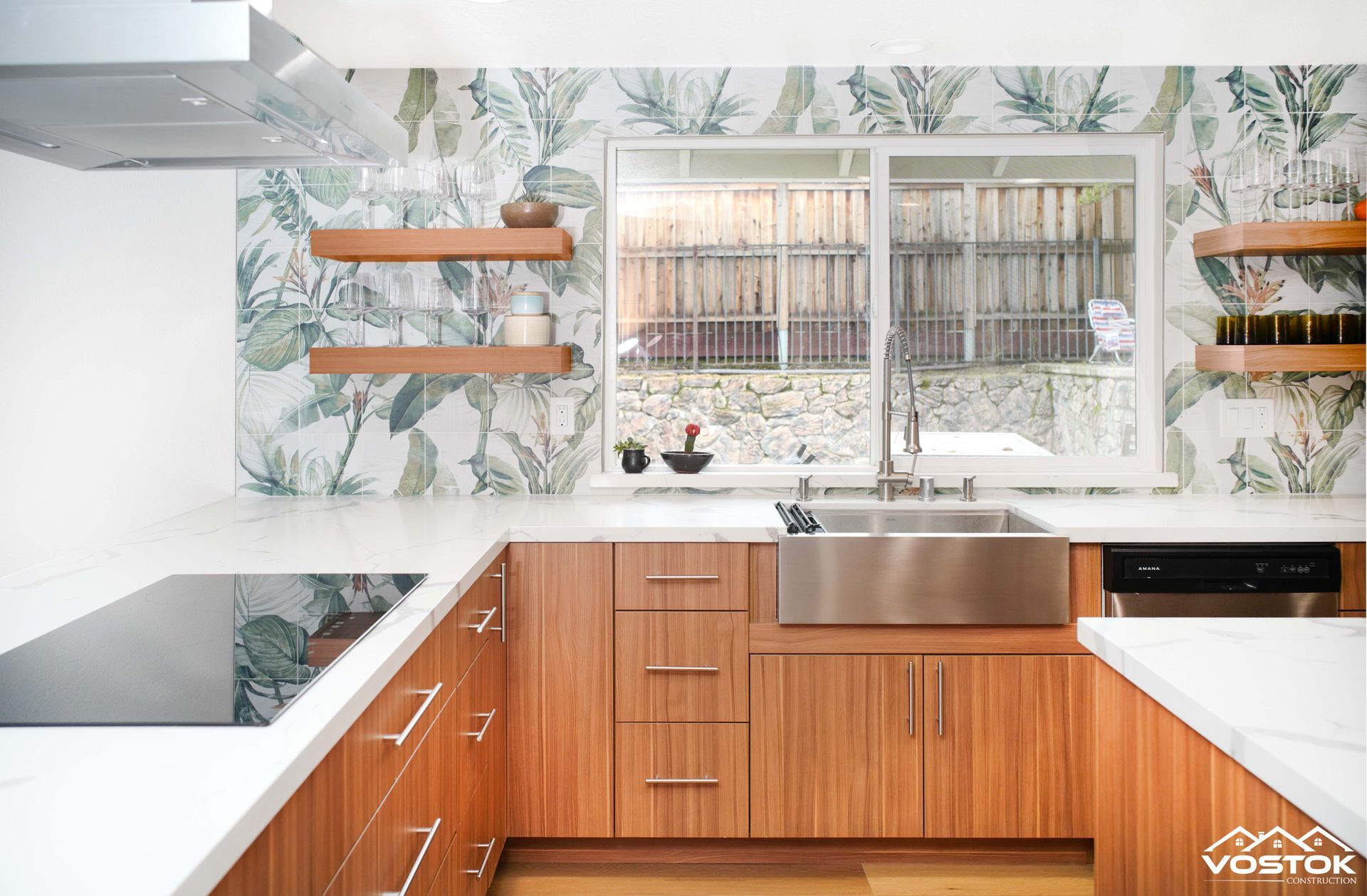 A kitchen with wooden cabinets and a stainless steel sink.