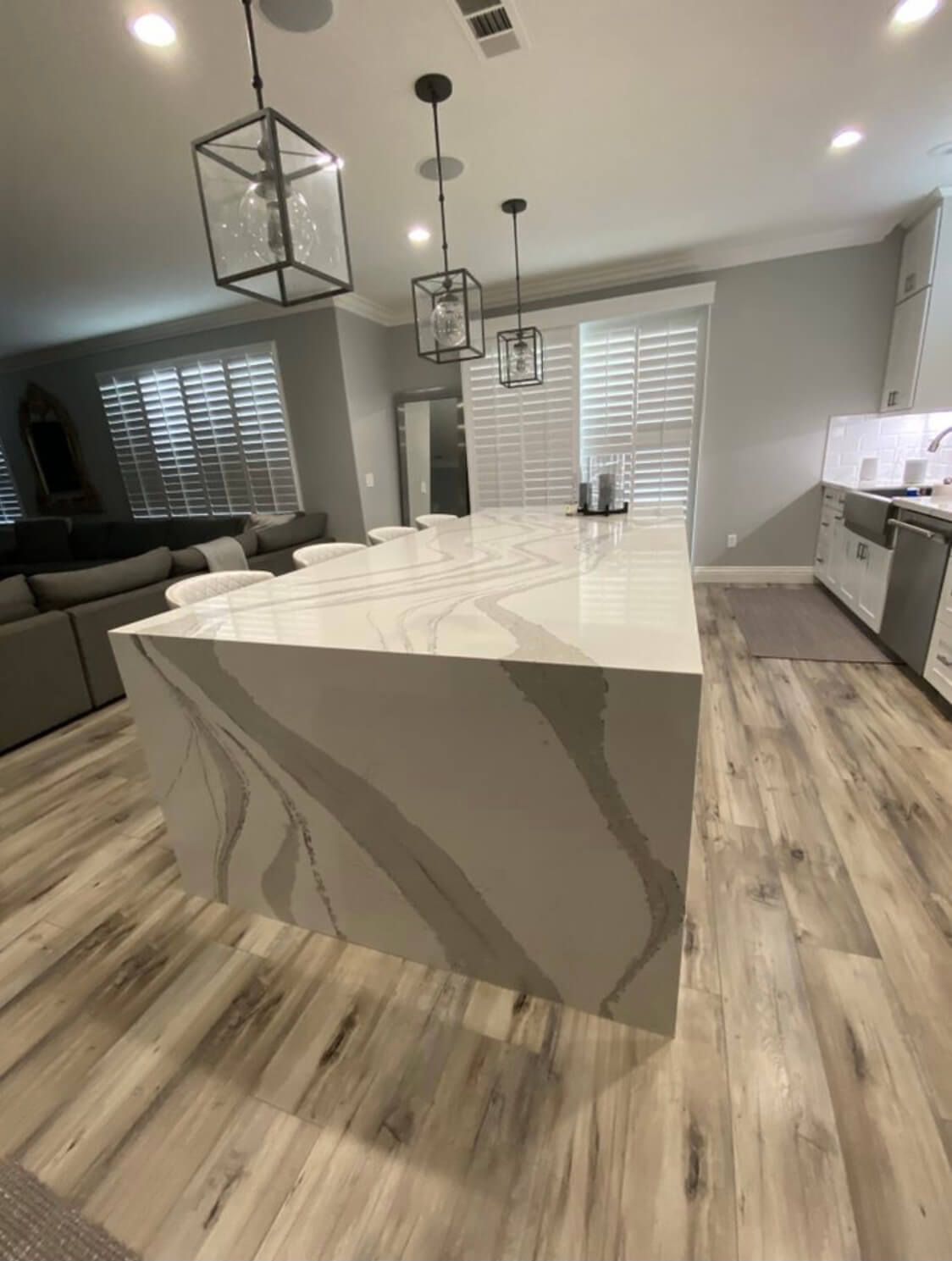 A kitchen with a large island in the middle of the room.