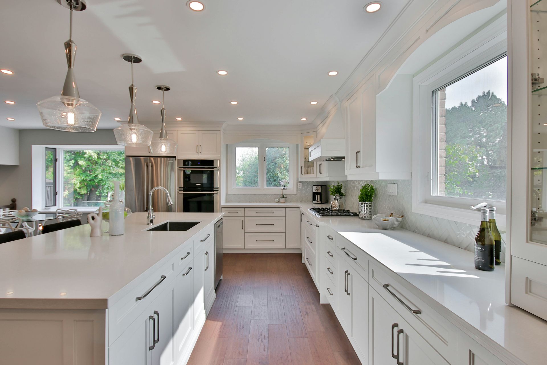 A kitchen with lots of windows and natural light
