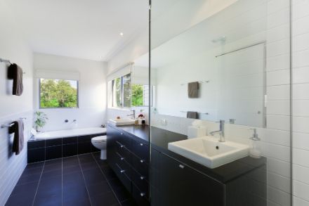 A Bathroom With A Sink, Toilet, And Bathtub — South East Kitchens In Burleigh Heads, QLD
