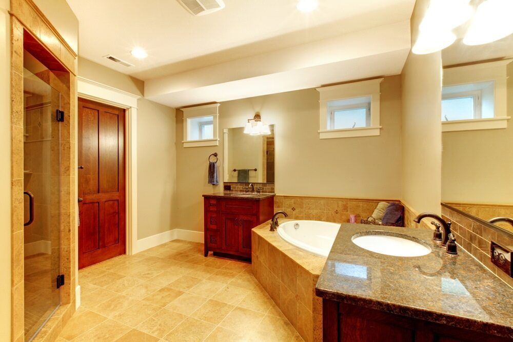 A Bathroom With A Tub, Sink, Mirror And Walk In Shower — South East Kitchens In Northern Rivers, NSW