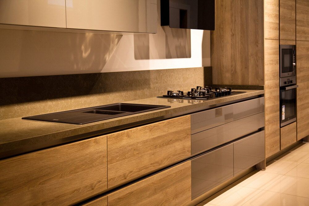 A Kitchen With Wooden Cabinets And Stainless Steel Appliances — South East Kitchens In Northern Rivers, NSW