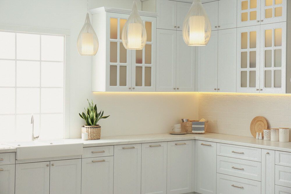 A Kitchen With White Cabinets, A Sink, And A Window — South East Kitchens In Northern Rivers, NSW